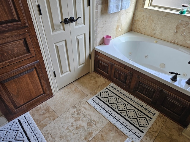 full bath with a whirlpool tub