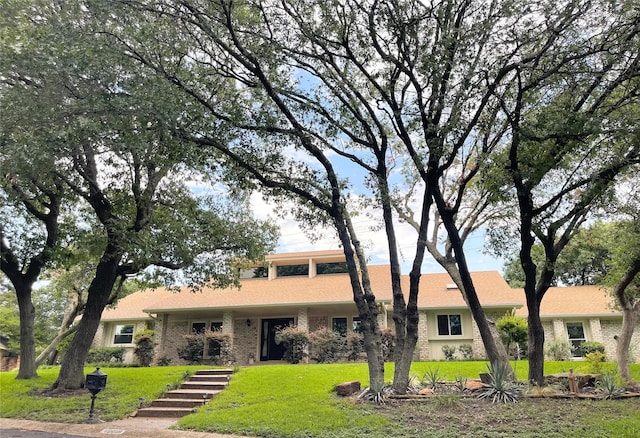 10019 Lost Oak Ridge Dr, Woodway, TX 76712 - view of front facade with a front yard and brick siding