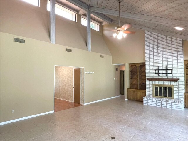 10019 Lost Oak Ridge Dr, Woodway, TX 76712 - unfurnished living room with ceiling fan, high vaulted ceiling, a brick fireplace, baseboards, and tile patterned floors
