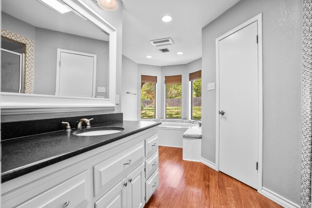 10019 Lost Oak Ridge Dr, Woodway, TX 76712 - bathroom with a garden tub and a textured wall