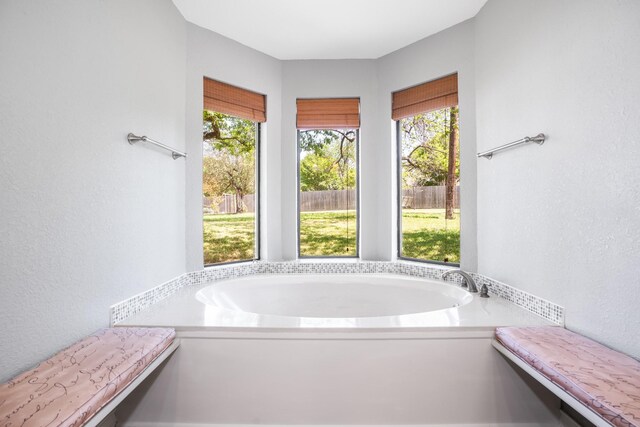 10019 Lost Oak Ridge Dr, Woodway, TX 76712 - full bathroom with a garden tub and a textured wall