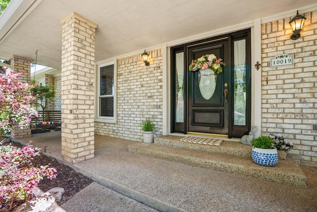 10019 Lost Oak Ridge Dr, Woodway, TX 76712 - view of exterior entry with a porch and brick siding