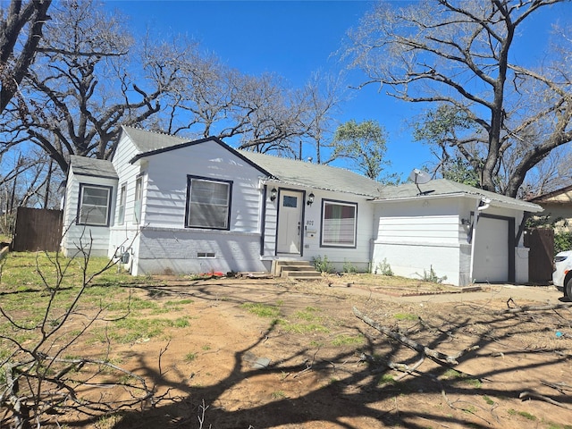 view of front facade with a garage and crawl space
