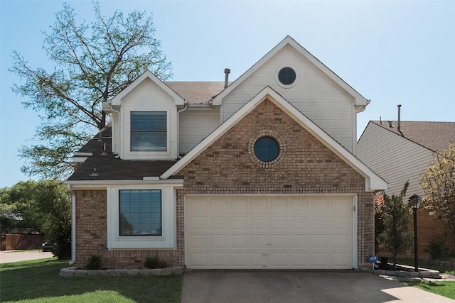 traditional-style house with concrete driveway, a shingled roof, brick siding, and a garage