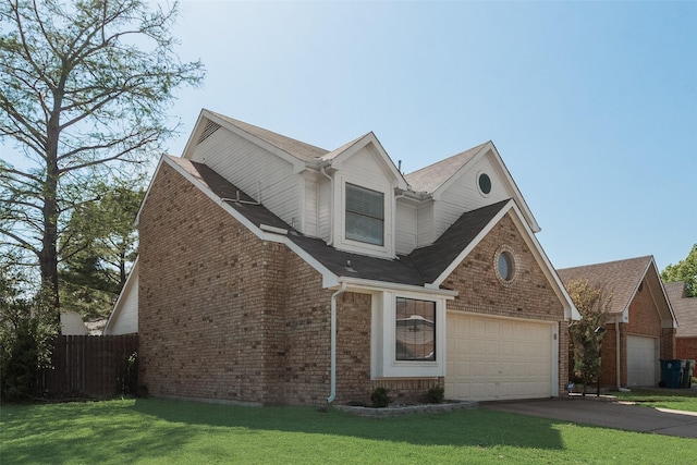 view of front of home featuring a front lawn, driveway, brick siding, and a garage