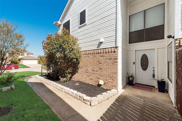 view of side of property with brick siding