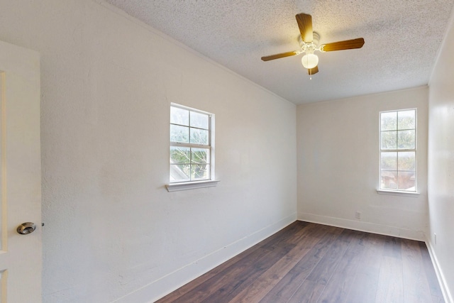 2311 Market Ave, Fort Worth, TX 76164 - unfurnished room with a textured ceiling, baseboards, and dark wood finished floors