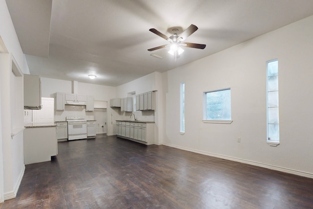 2311 Market Ave, Fort Worth, TX 76164 - unfurnished living room featuring a sink, dark wood-style flooring, ceiling fan, and baseboards