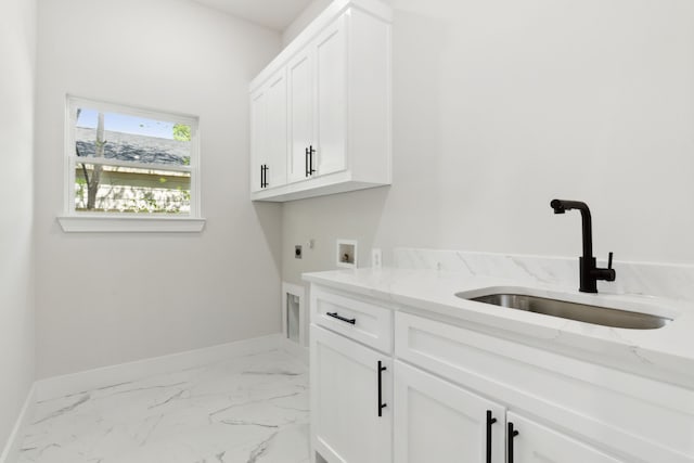 2239 Scotland Dr, Dallas, TX 75216 - washroom featuring washer hookup, a sink, hookup for an electric dryer, cabinet space, and marble finish floor