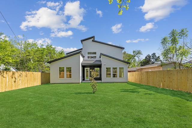 2239 Scotland Dr, Dallas, TX 75216 - back of property featuring a yard and a fenced backyard