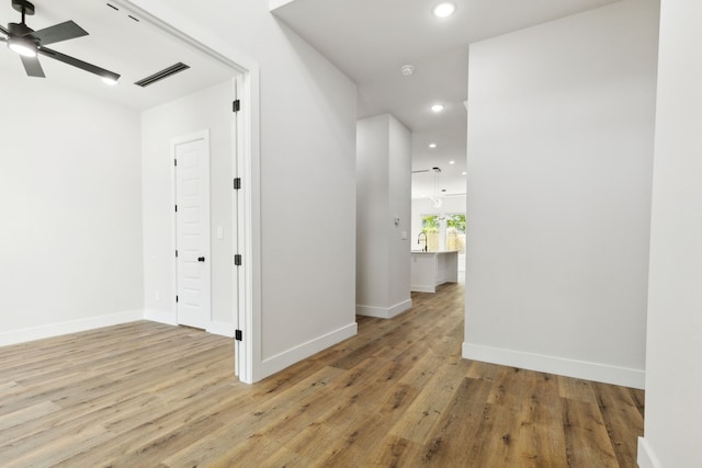 2239 Scotland Dr, Dallas, TX 75216 - hallway with light wood-style flooring, baseboards, visible vents, and recessed lighting
