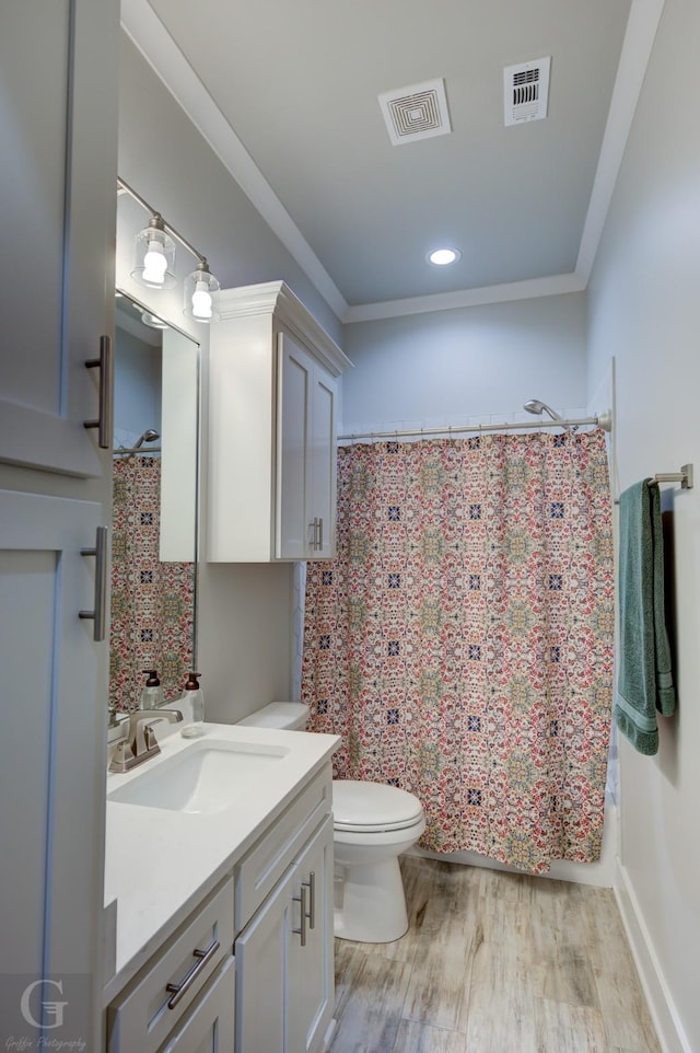 262 Poydras Ave, Bossier City, LA 71111 - full bathroom featuring vanity, visible vents, toilet, and wood finished floors