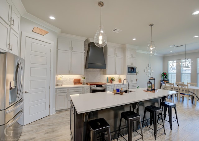 262 Poydras Ave, Bossier City, LA 71111 - kitchen with custom range hood, crown molding, backsplash, visible vents, and stainless steel appliances