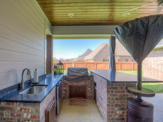 262 Poydras Ave, Bossier City, LA 71111 - view of patio with a sink, a fenced backyard, exterior kitchen, and a grill