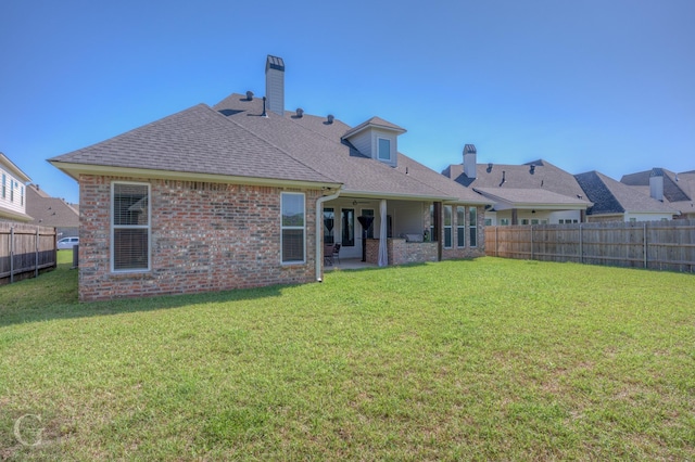 262 Poydras Ave, Bossier City, LA 71111 - rear view of house with a yard, a fenced backyard, and a shingled roof