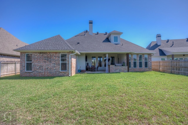 262 Poydras Ave, Bossier City, LA 71111 - back of house featuring a patio area, brick siding, a fenced backyard, and a yard
