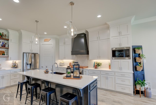 262 Poydras Ave, Bossier City, LA 71111 - kitchen featuring white cabinets, custom exhaust hood, light countertops, stainless steel appliances, and decorative backsplash
