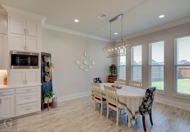 262 Poydras Ave, Bossier City, LA 71111 - dining area with a chandelier, visible vents, baseboards, and crown molding