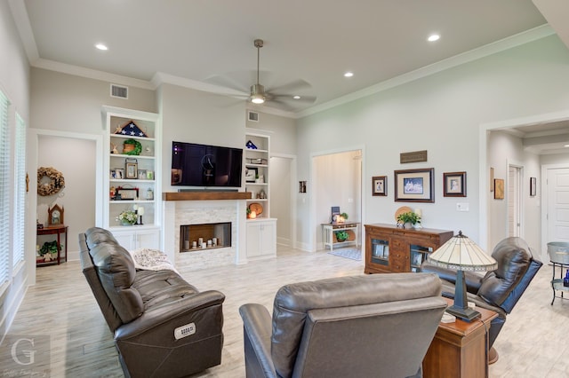 262 Poydras Ave, Bossier City, LA 71111 - living room featuring recessed lighting, light wood-style flooring, a stone fireplace, and a ceiling fan