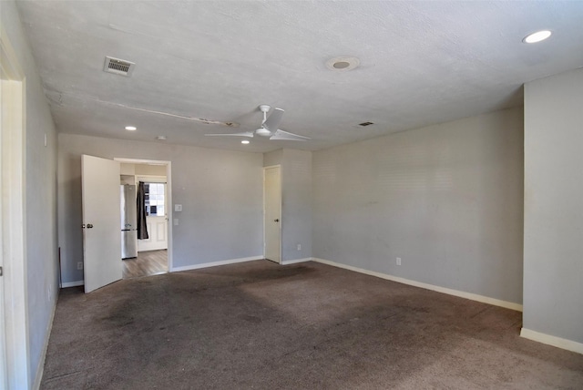 unfurnished room with baseboards, carpet, visible vents, and recessed lighting