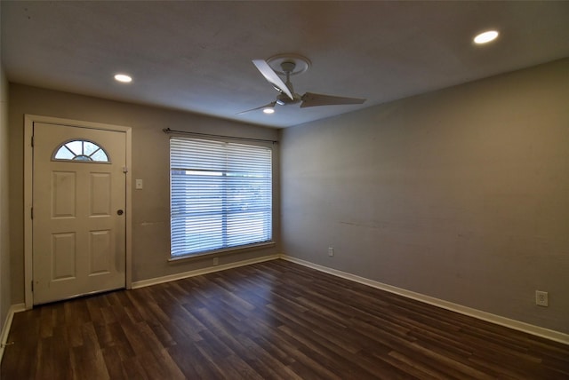 entryway with dark wood-style flooring, baseboards, and a ceiling fan