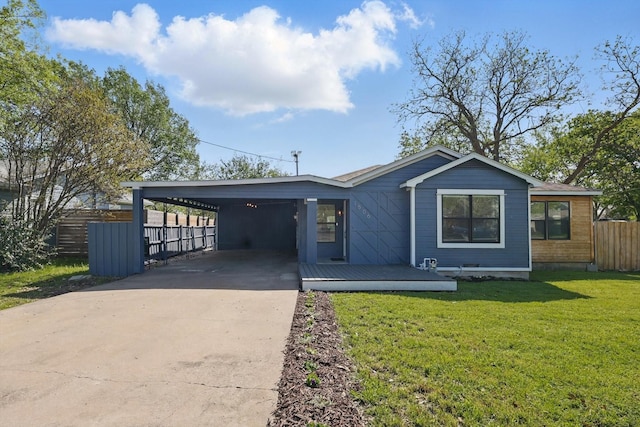 view of front of home featuring driveway and a carport