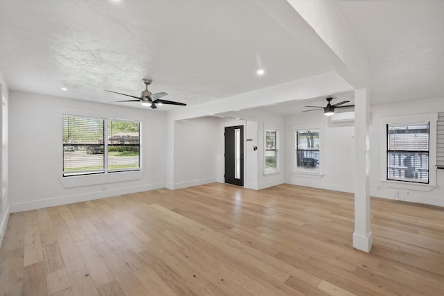 unfurnished living room with a ceiling fan, baseboards, light wood-type flooring, and recessed lighting