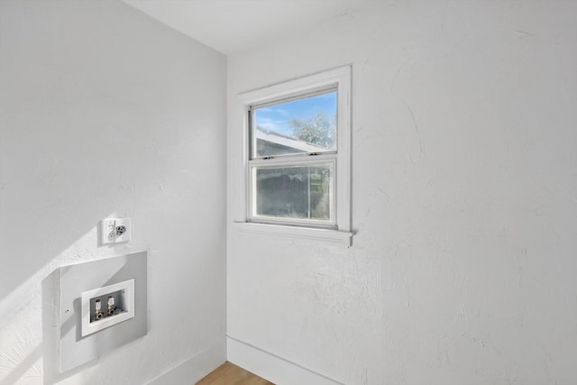 laundry view of baseboards