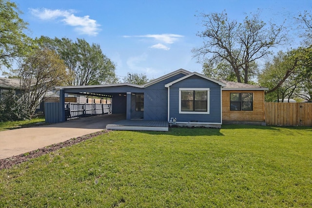 view of front of house with concrete driveway and a carport