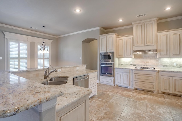 kitchen with tasteful backsplash, under cabinet range hood, visible vents, stainless steel appliances, and a sink