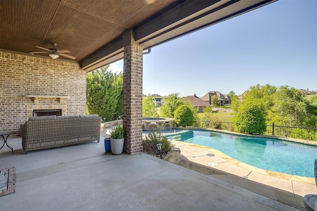 view of swimming pool with a patio, ceiling fan, a pool with connected hot tub, and fence