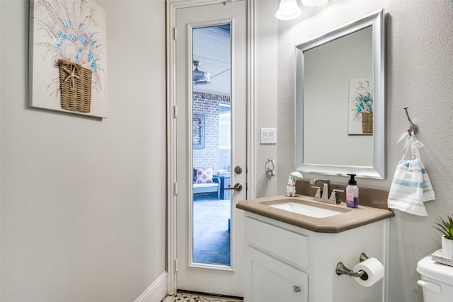 1765 Bramshaw Trl, Farmers Branch, TX 75234 - half bath featuring toilet, a textured wall, and vanity