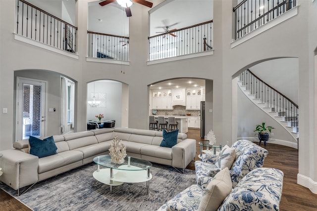 1765 Bramshaw Trl, Farmers Branch, TX 75234 - living area with baseboards, a ceiling fan, wood finished floors, and arched walkways