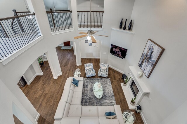 1765 Bramshaw Trl, Farmers Branch, TX 75234 - kitchen featuring custom exhaust hood, tasteful backsplash, arched walkways, stainless steel appliances, and dark wood-type flooring