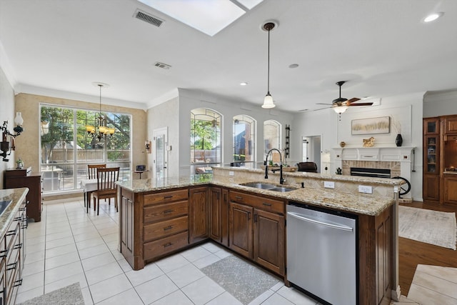 kitchen featuring a sink, visible vents, ornamental molding, and dishwasher