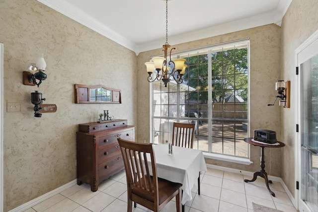 dining area with light tile patterned floors, baseboards, an inviting chandelier, and crown molding