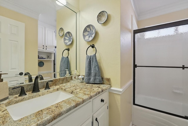 full bath with ornamental molding and vanity