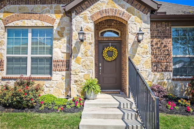 1421 Sage Way, Little Elm, TX 76227 - doorway to property with stone siding and brick siding
