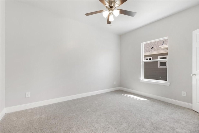 unfurnished room featuring ceiling fan, baseboards, and carpet