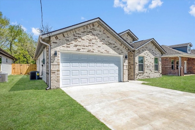 view of front of home with central AC, a front yard, a garage, fence, and driveway