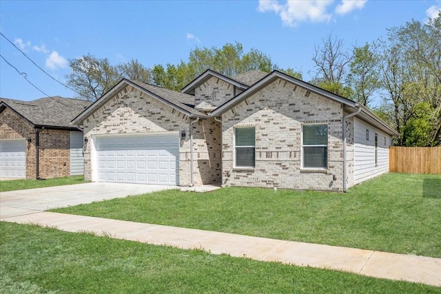 view of front of home with a front yard, fence, a garage, and concrete driveway