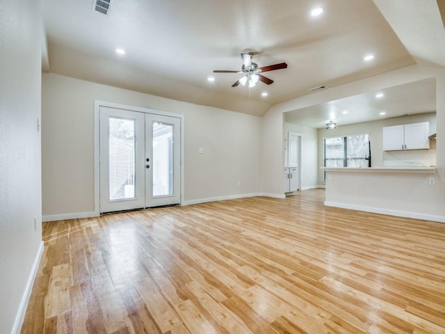 unfurnished living room featuring light wood-style floors, ceiling fan, baseboards, and visible vents