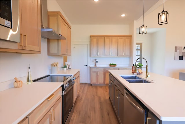 kitchen with a sink, light countertops, range with electric cooktop, and dishwasher