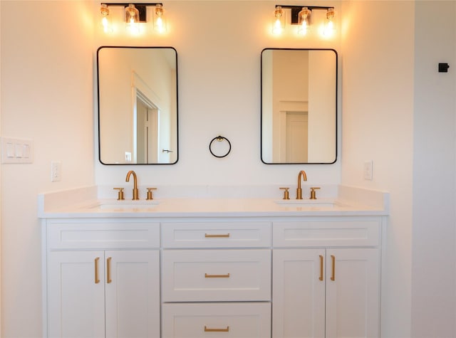 full bath featuring double vanity and a sink