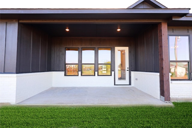 entrance to property with brick siding