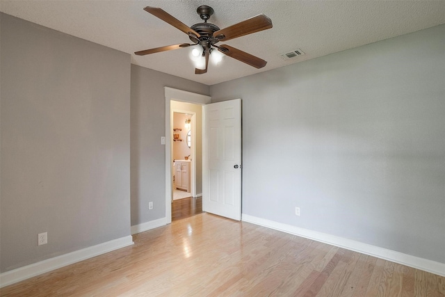 603 S 2nd St, Midlothian, TX 76065 - unfurnished room with a ceiling fan, light wood finished floors, and baseboards