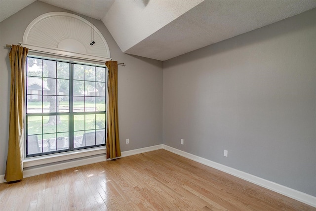 603 S 2nd St, Midlothian, TX 76065 - spare room with light wood-type flooring, lofted ceiling, and baseboards