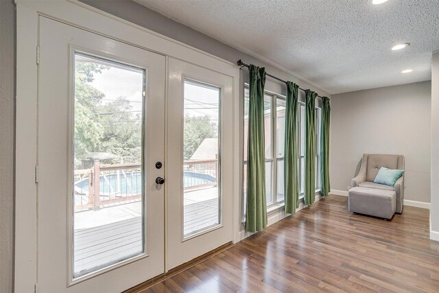 603 S 2nd St, Midlothian, TX 76065 - doorway to outside featuring french doors, wood finished floors, a textured ceiling, baseboards, and recessed lighting
