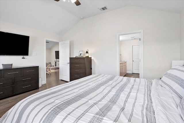 303 W Ohio Ave, Dallas, TX 75224 - bedroom with visible vents, dark wood-style flooring, ceiling fan, ensuite bath, and vaulted ceiling