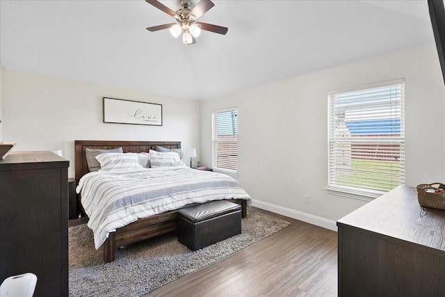 303 W Ohio Ave, Dallas, TX 75224 - bedroom featuring baseboards, wood finished floors, vaulted ceiling, and a ceiling fan